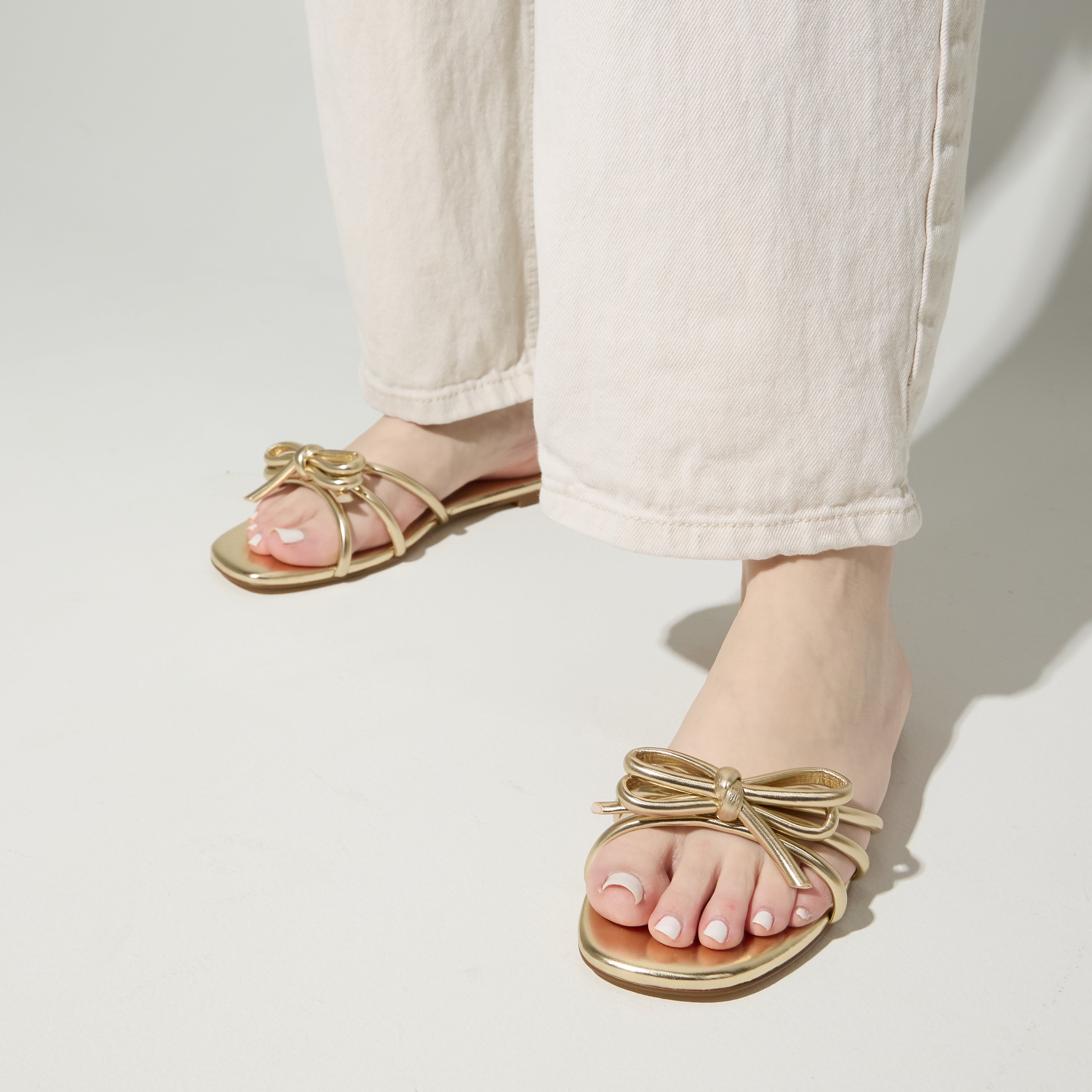 Nicole Bow Slide Sandal in Gold